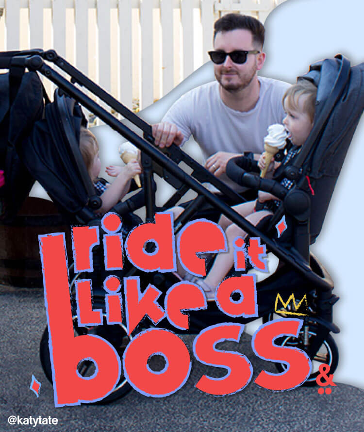 two toddlers eating ice cream sitting in modular pram seats facing eachother while dad looks on - philandteds inline voyager pram